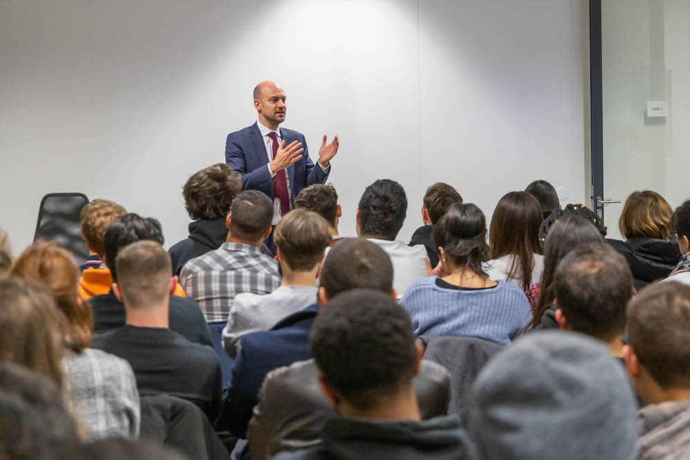 Jean‑Noël BARROT discussing with the students